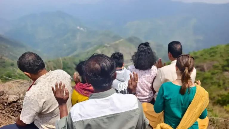 group of people meditating in vagamon hills